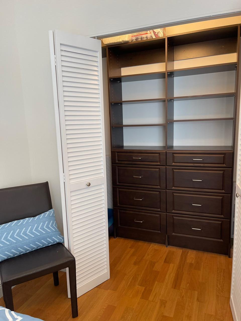 255 Evernia Street, Unit 407 West Palm Beach, FL 33401 - Photo 26 of 31 a room with a walk in closet and a chair