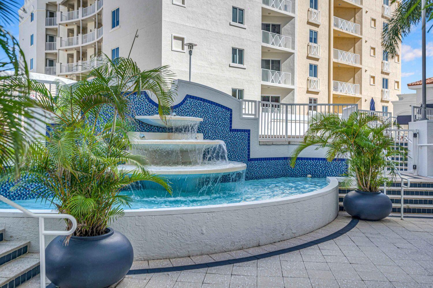 255 Evernia Street, Unit 407 West Palm Beach, FL 33401 - Photo 29 of 31 a view of a potted plants in front of a building