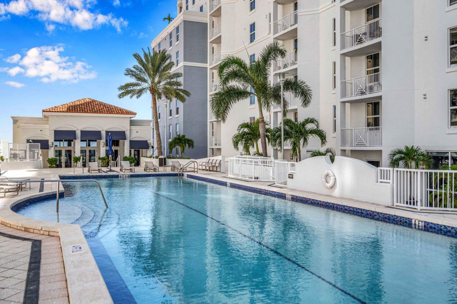 255 Evernia Street, Unit 407 West Palm Beach, FL 33401 - Photo 31 of 31 a swimming pool with outdoor seating and yard