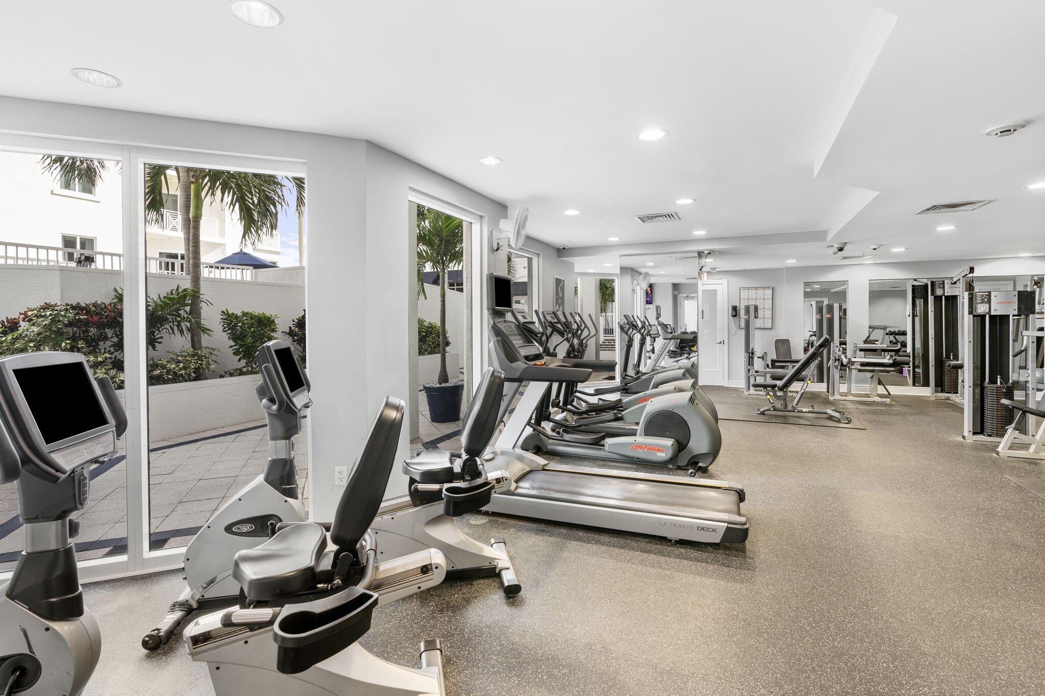 255 Evernia Street, Unit 407 West Palm Beach, FL 33401 - Photo 6 of 31 a view of a room with gym equipment