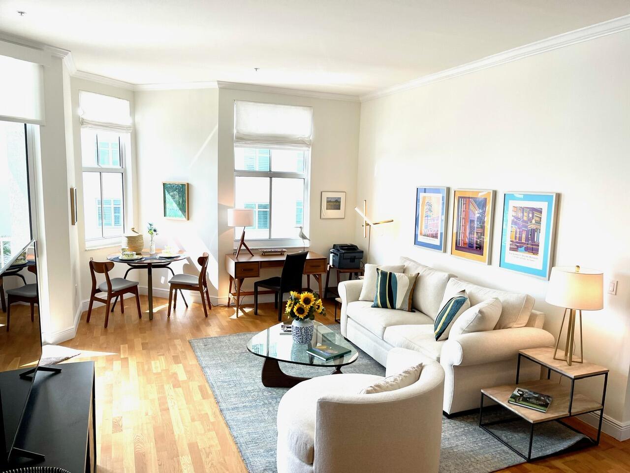 255 Evernia Street, Unit 407 West Palm Beach, FL 33401 - Photo 10 of 31 a living room with furniture and a large window