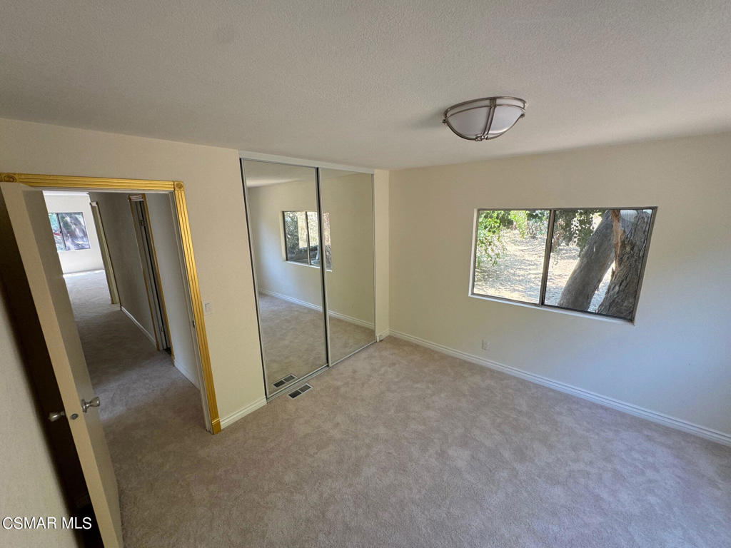 24303 Woolsey Canoga Park, Unit 26 Los Angeles, CA 90068 - Photo 14 of 28 an empty room with windows
