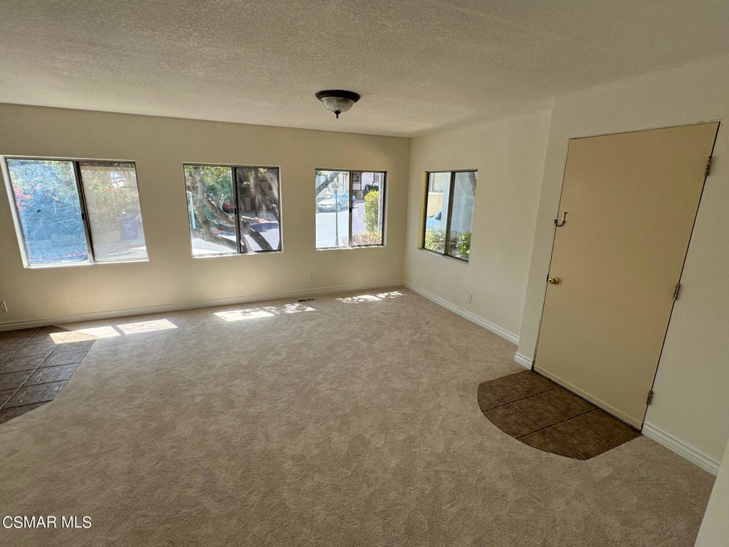 24303 Woolsey Canoga Park, Unit 26 Los Angeles, CA 90068 - Photo 16 of 28 a view of livingroom with window and hardwood floor
