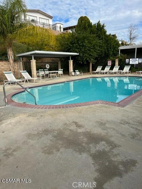 24303 Woolsey Canoga Park, Unit 26 Los Angeles, CA 90068 - Photo 23 of 28 a view of a house with a swimming pool