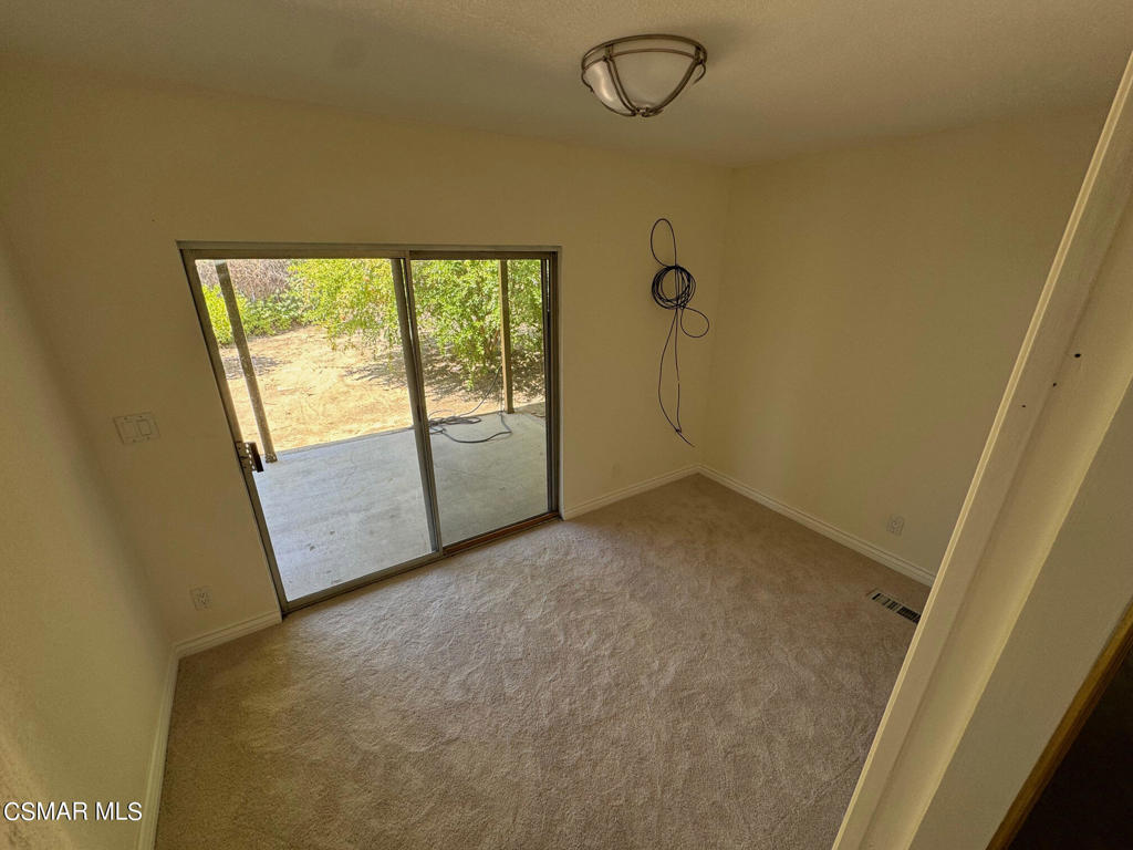24303 Woolsey Canoga Park, Unit 26 Los Angeles, CA 90068 - Photo 10 of 28 a view of an empty room with a window