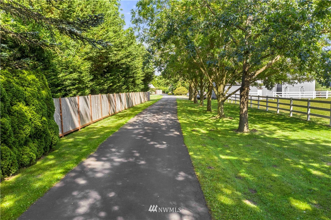 9451 Avon Allen Road Bow, WA 98232 - Photo 2 of 40 a view of a yard with large trees