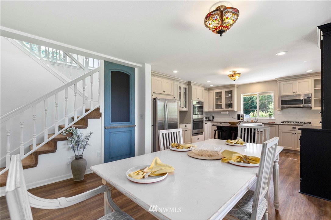 9451 Avon Allen Road Bow, WA 98232 - Photo 17 of 40 a view of a dining room and livingroom with furniture