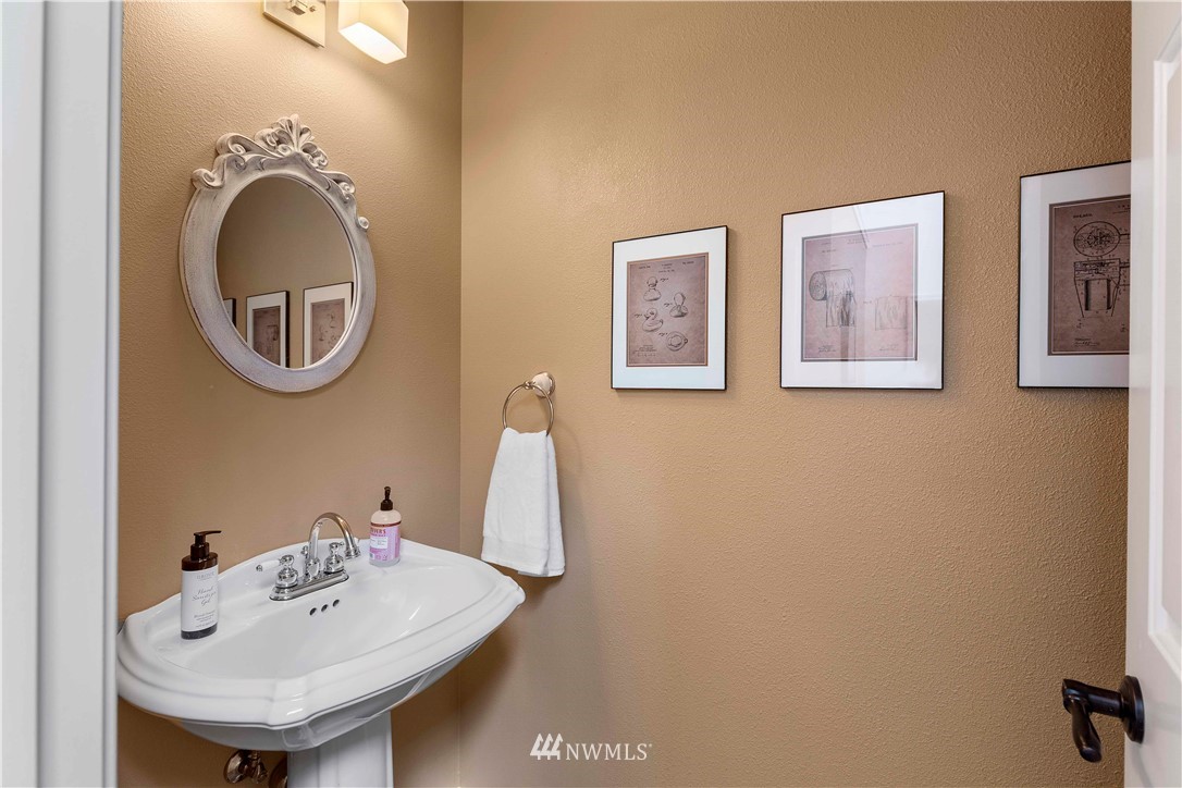 9451 Avon Allen Road Bow, WA 98232 - Photo 18 of 40 a bathroom with a sink and a mirror