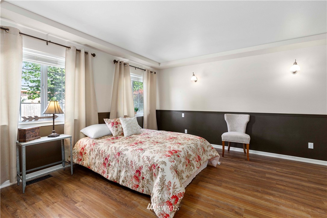 9451 Avon Allen Road Bow, WA 98232 - Photo 21 of 40 a bedroom with a bed and window