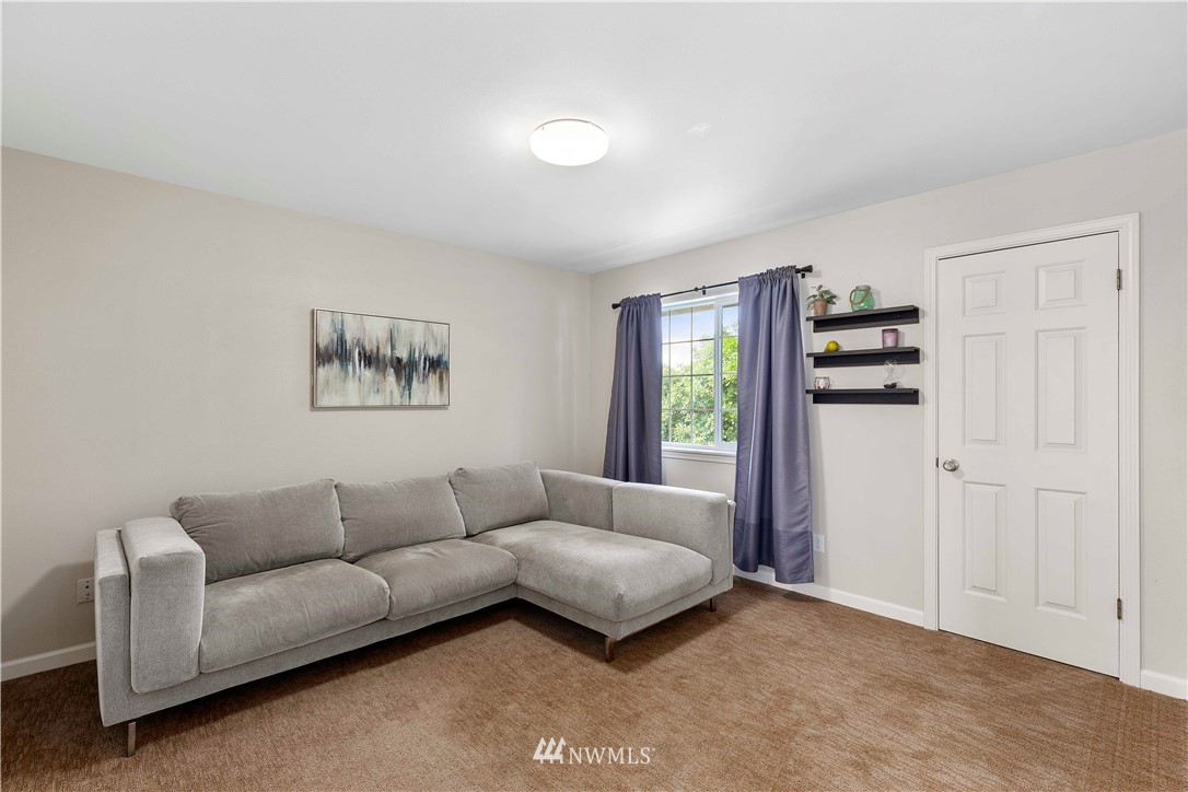 9451 Avon Allen Road Bow, WA 98232 - Photo 26 of 40 a living room with furniture and a window