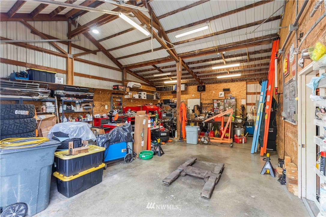 9451 Avon Allen Road Bow, WA 98232 - Photo 38 of 40 a view of a storage room with racks