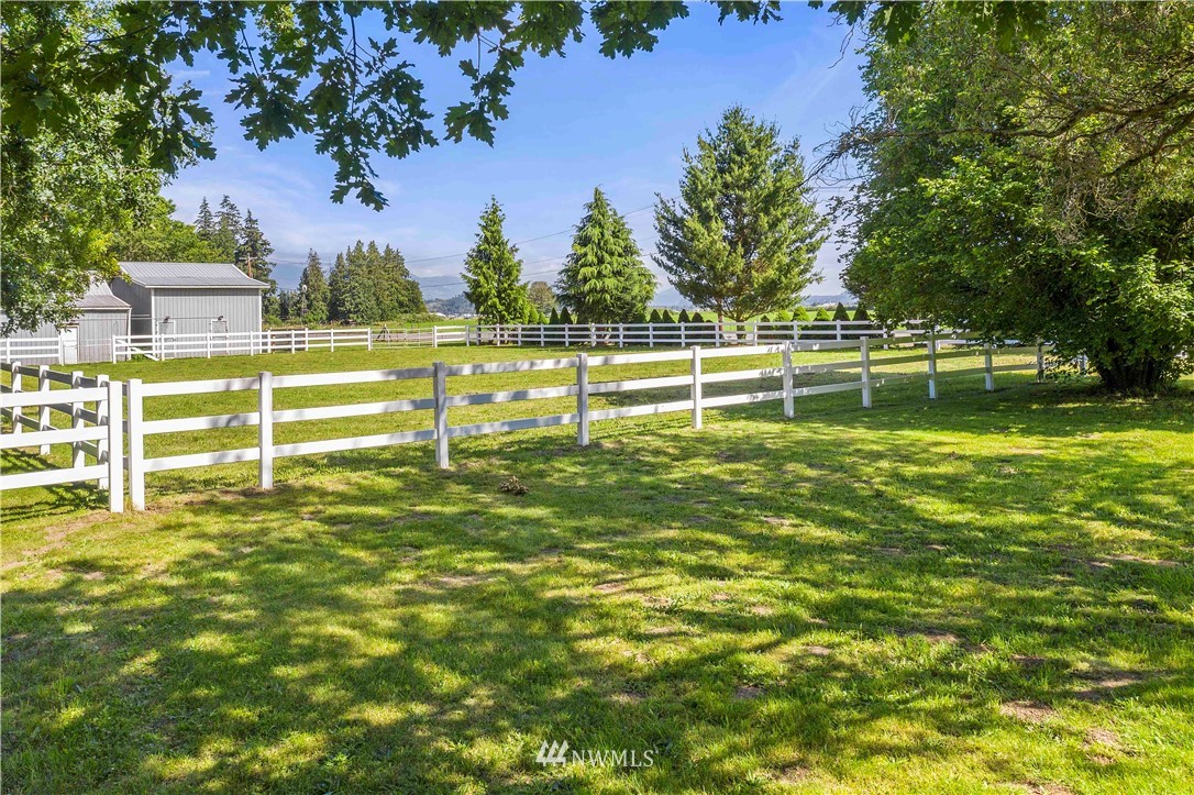 9451 Avon Allen Road Bow, WA 98232 - Photo 39 of 40 a view of a green field with fountain in the background