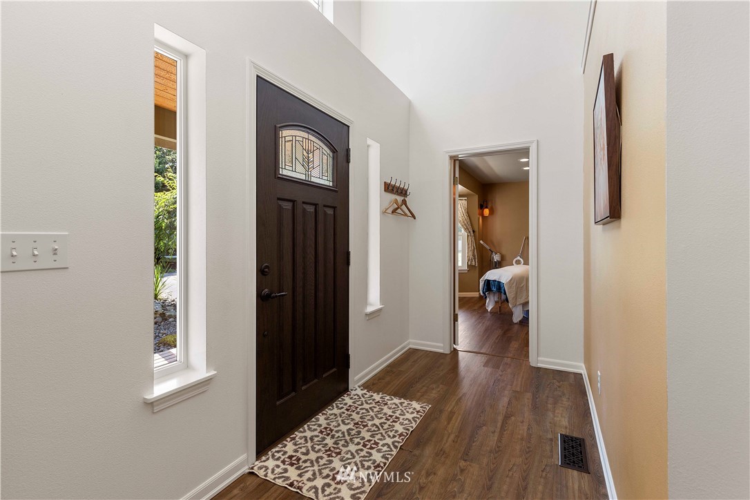 9451 Avon Allen Road Bow, WA 98232 - Photo 5 of 40 a view of hallway with wooden floor
