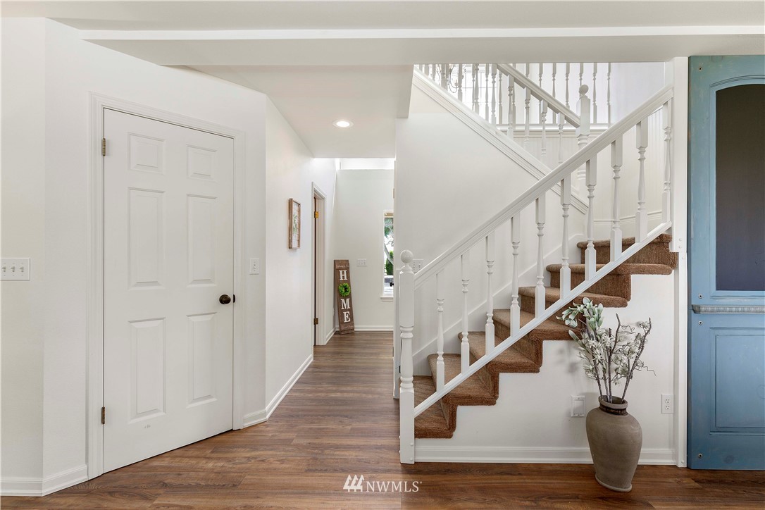 9451 Avon Allen Road Bow, WA 98232 - Photo 6 of 40 a view of entryway and hall with wooden floor
