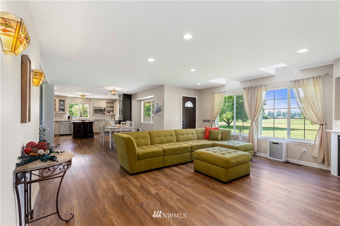 9451 Avon Allen Road Bow, WA 98232 - Photo 9 of 40 a living room with furniture and a flat screen tv