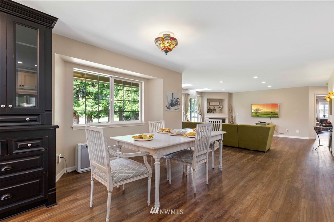 9451 Avon Allen Road Bow, WA 98232 - Photo 10 of 40 a view of a dining room with furniture window and wooden floor