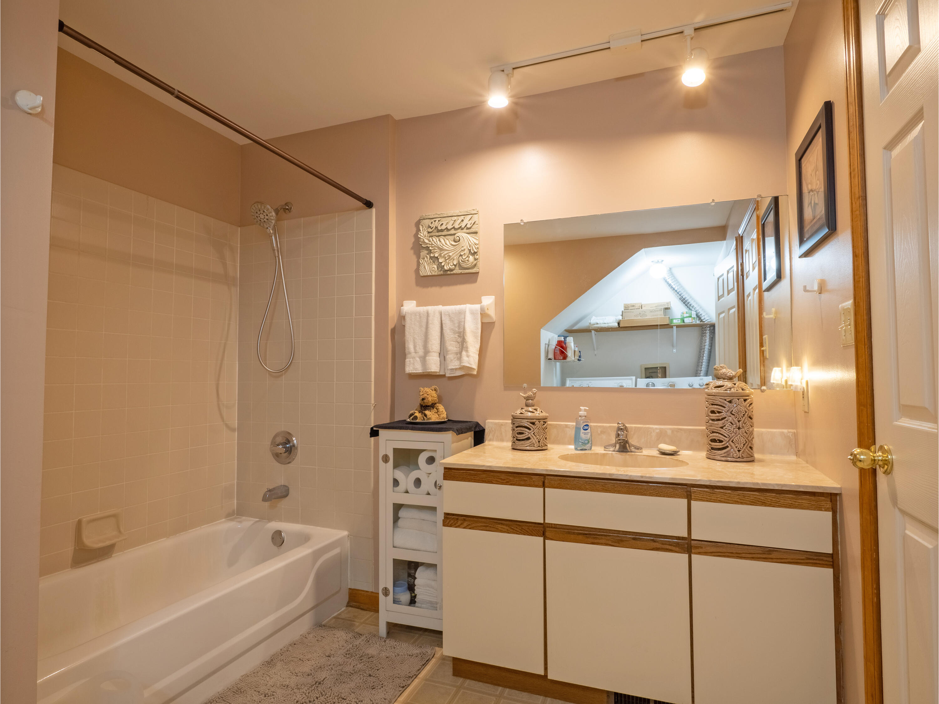 1362 West 94th Court Crown Point, IN 46307 - Photo 12 of 23 a bathroom with a bathtub sink vanity mirror and a toilet