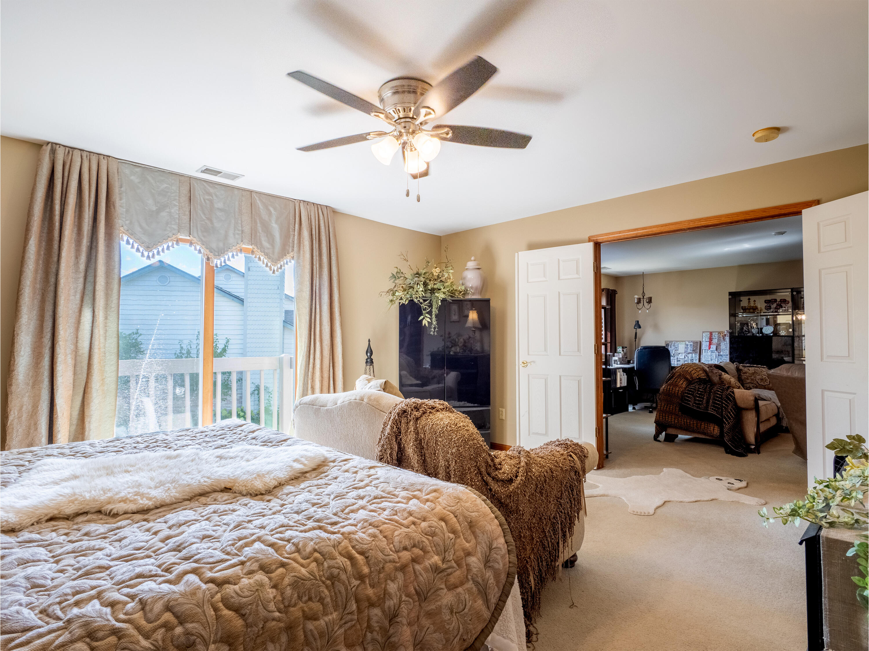 1362 West 94th Court Crown Point, IN 46307 - Photo 18 of 23 a spacious bedroom with a bed and ceiling fan
