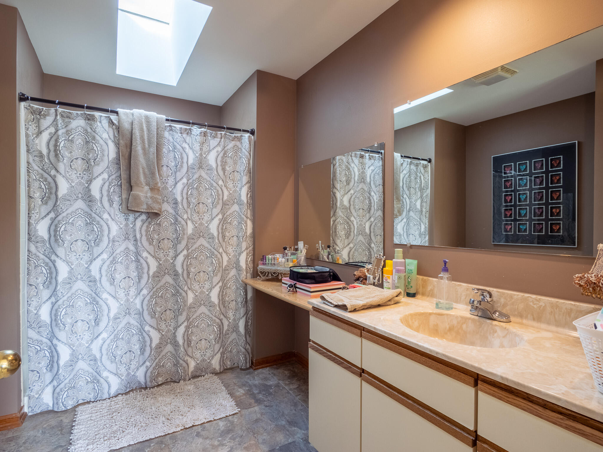 1362 West 94th Court Crown Point, IN 46307 - Photo 19 of 23 a bathroom with a sink and a mirror