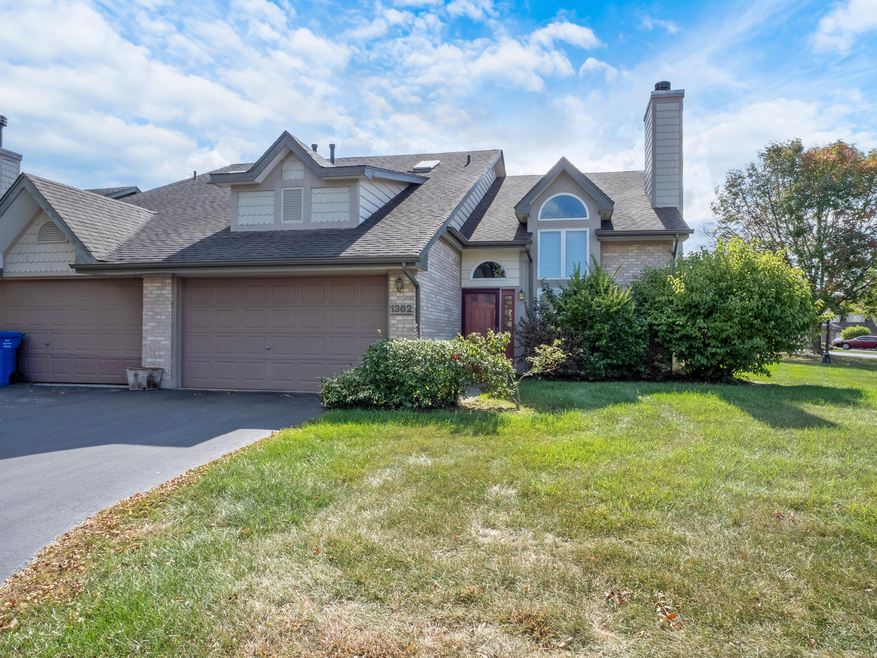 1362 West 94th Court Crown Point, IN 46307 - Photo 2 of 23 a front view of a house with garden