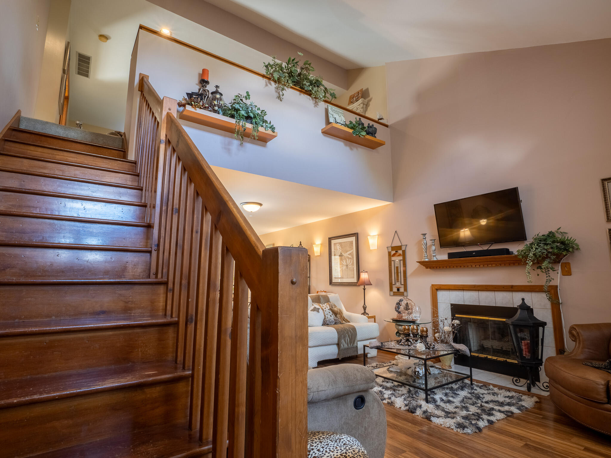 1362 West 94th Court Crown Point, IN 46307 - Photo 3 of 23 a living room with furniture a flat screen tv and a fireplace