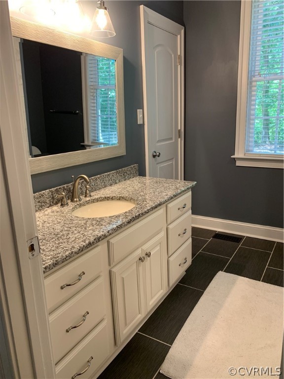 20710 River Road Chesterfield, VA 23838 - Photo 12 of 24 a bathroom with a sink and a mirror
