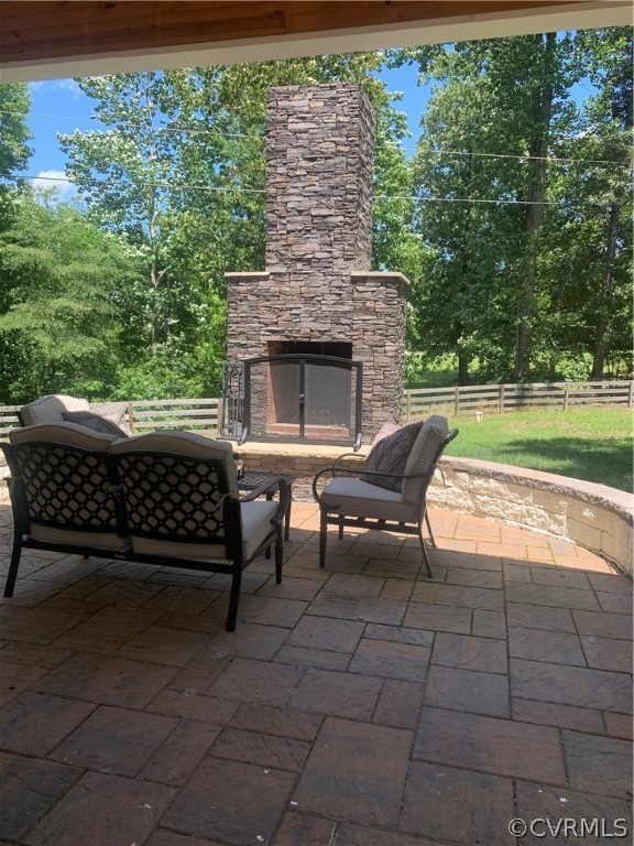 20710 River Road Chesterfield, VA 23838 - Photo 18 of 24 a view of a patio with table and chairs with wooden floor and fence