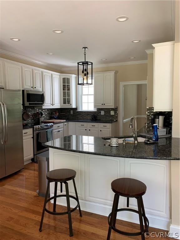 20710 River Road Chesterfield, VA 23838 - Photo 6 of 24 a kitchen with stainless steel appliances granite countertop a sink a stove a refrigerator cabinets and dining table