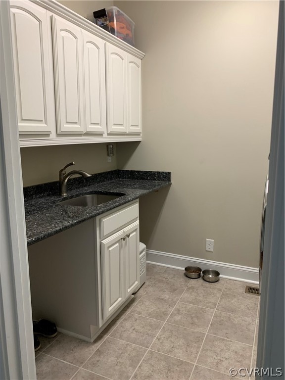20710 River Road Chesterfield, VA 23838 - Photo 8 of 24 a kitchen with granite countertop a sink and a stove