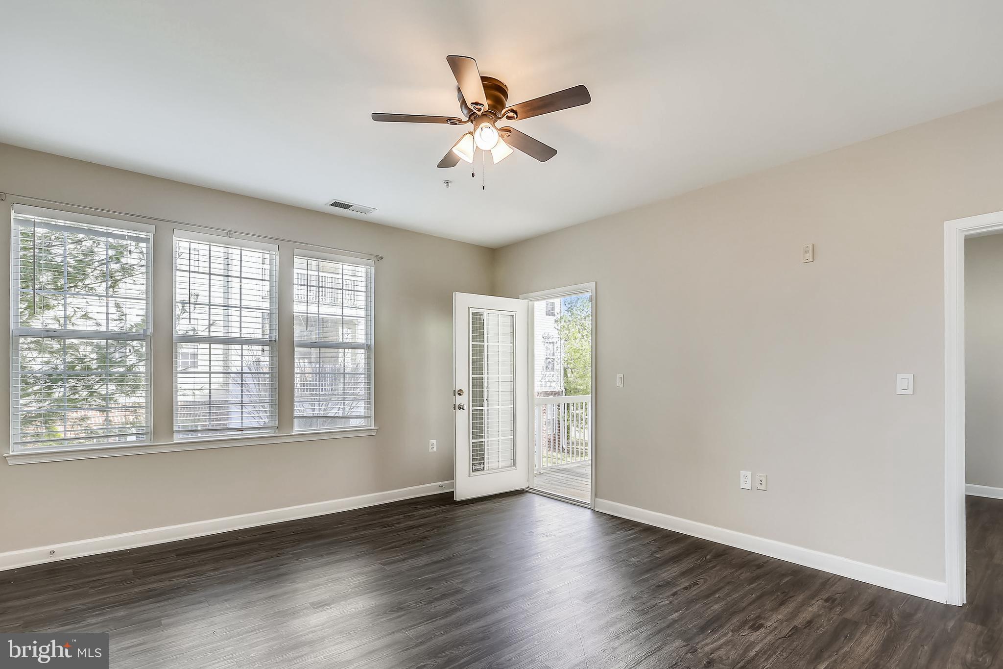 22641 Blue Elder Terrace, Unit 201 Brambleton, VA 20148 - Photo 3 of 42 Spacious & Bright Living area leads to Balcony