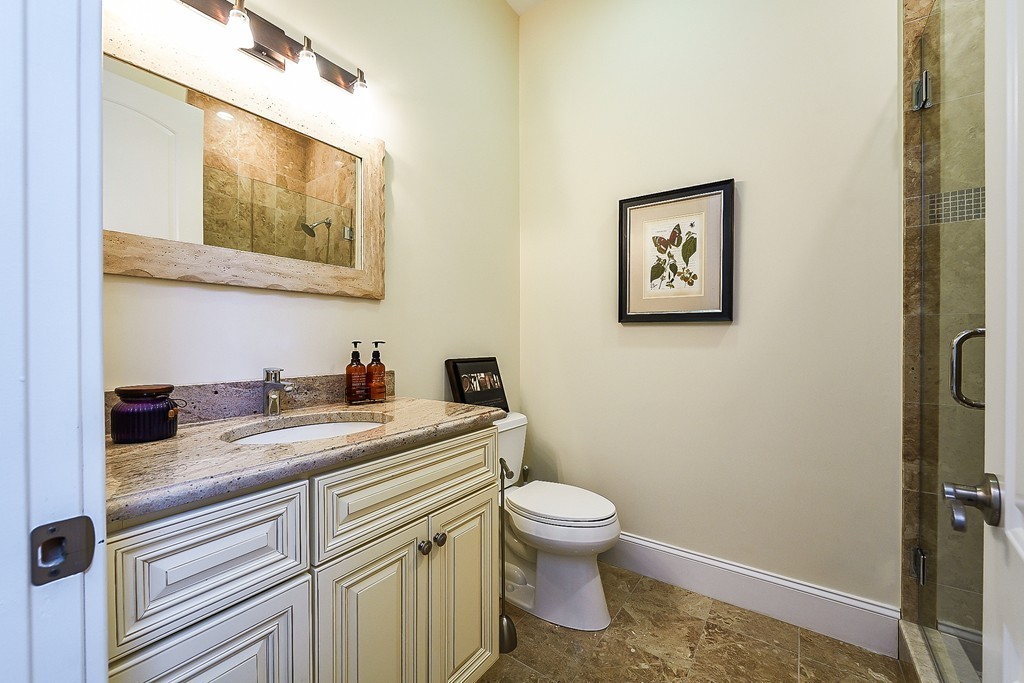 17 Drew Road Newton, MA 02467 - Photo 11 of 22 a bathroom with a granite countertop toilet sink and mirror