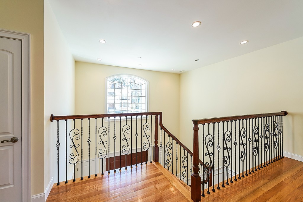 17 Drew Road Newton, MA 02467 - Photo 12 of 22 a view of hallway with wooden floor