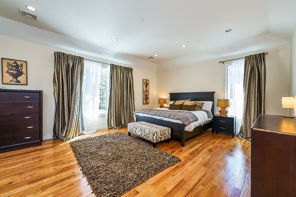 17 Drew Road Newton, MA 02467 - Photo 13 of 22 a bedroom with a bed and wooden floor