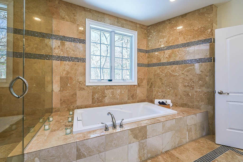 17 Drew Road Newton, MA 02467 - Photo 14 of 22 a bathroom with a tub and a shower