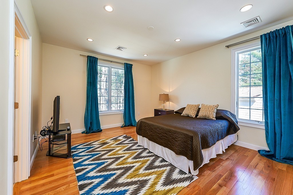 17 Drew Road Newton, MA 02467 - Photo 15 of 22 a bedroom with a bed and a large window