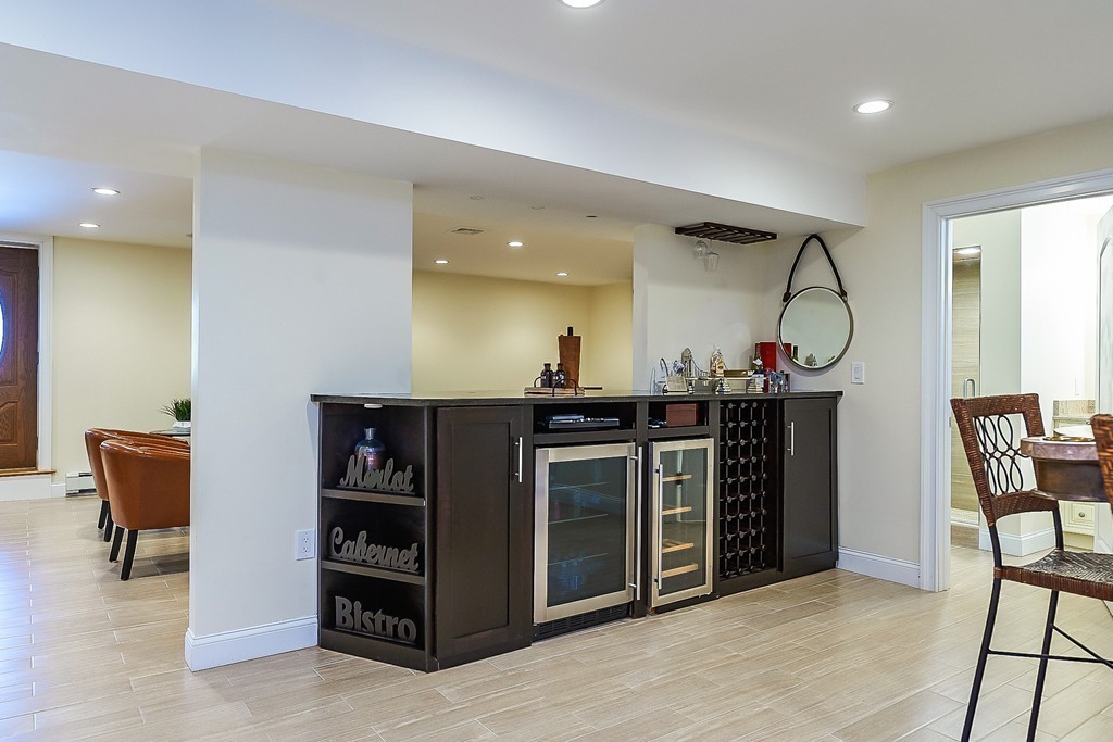 17 Drew Road Newton, MA 02467 - Photo 19 of 22 a kitchen with stainless steel appliances granite countertop a stove and a refrigerator