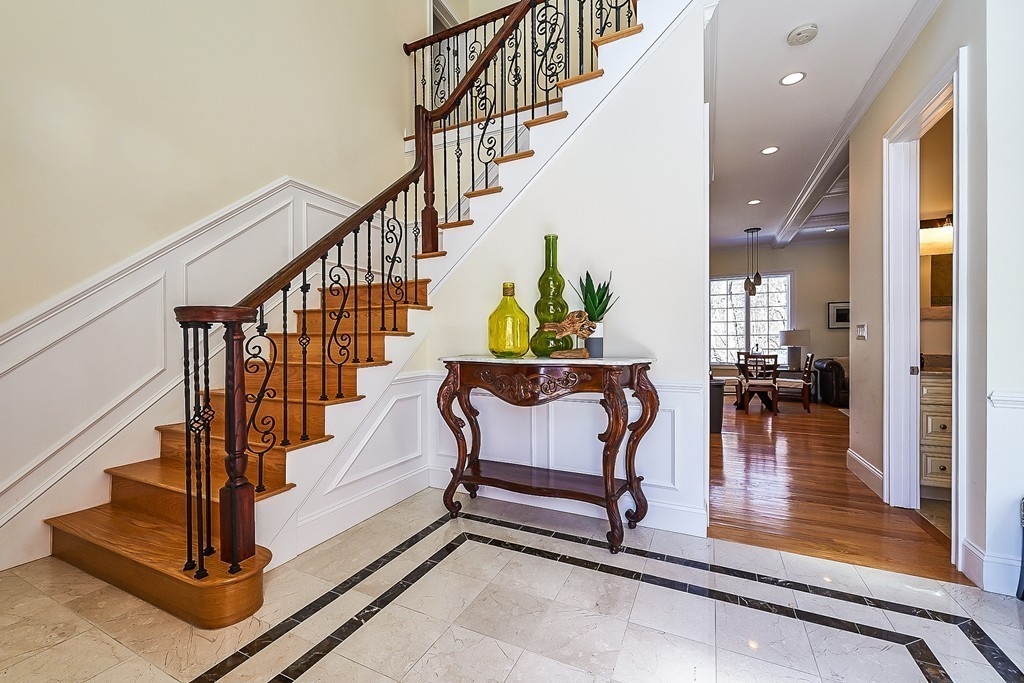 17 Drew Road Newton, MA 02467 - Photo 4 of 22 a swimming pool with glass top table and chairs