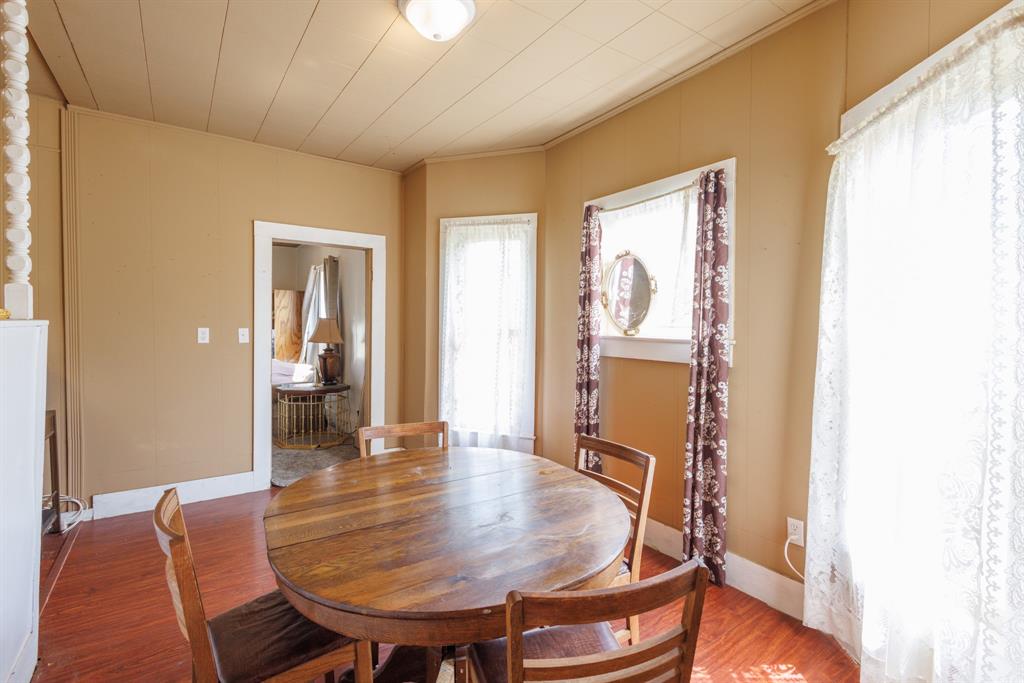 2202 Chester Street Sweetwater, TX 79556 - Photo 18 of 21 a dining room with furniture and wooden floor