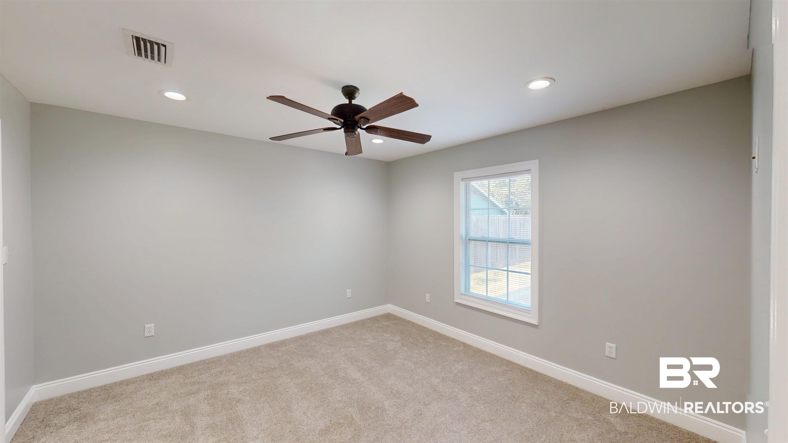 2454 Taylor Avenue Mobile, AL 36606 - Photo 16 of 24 Empty room with ceiling fan, light colored carpet, and recessed lighting