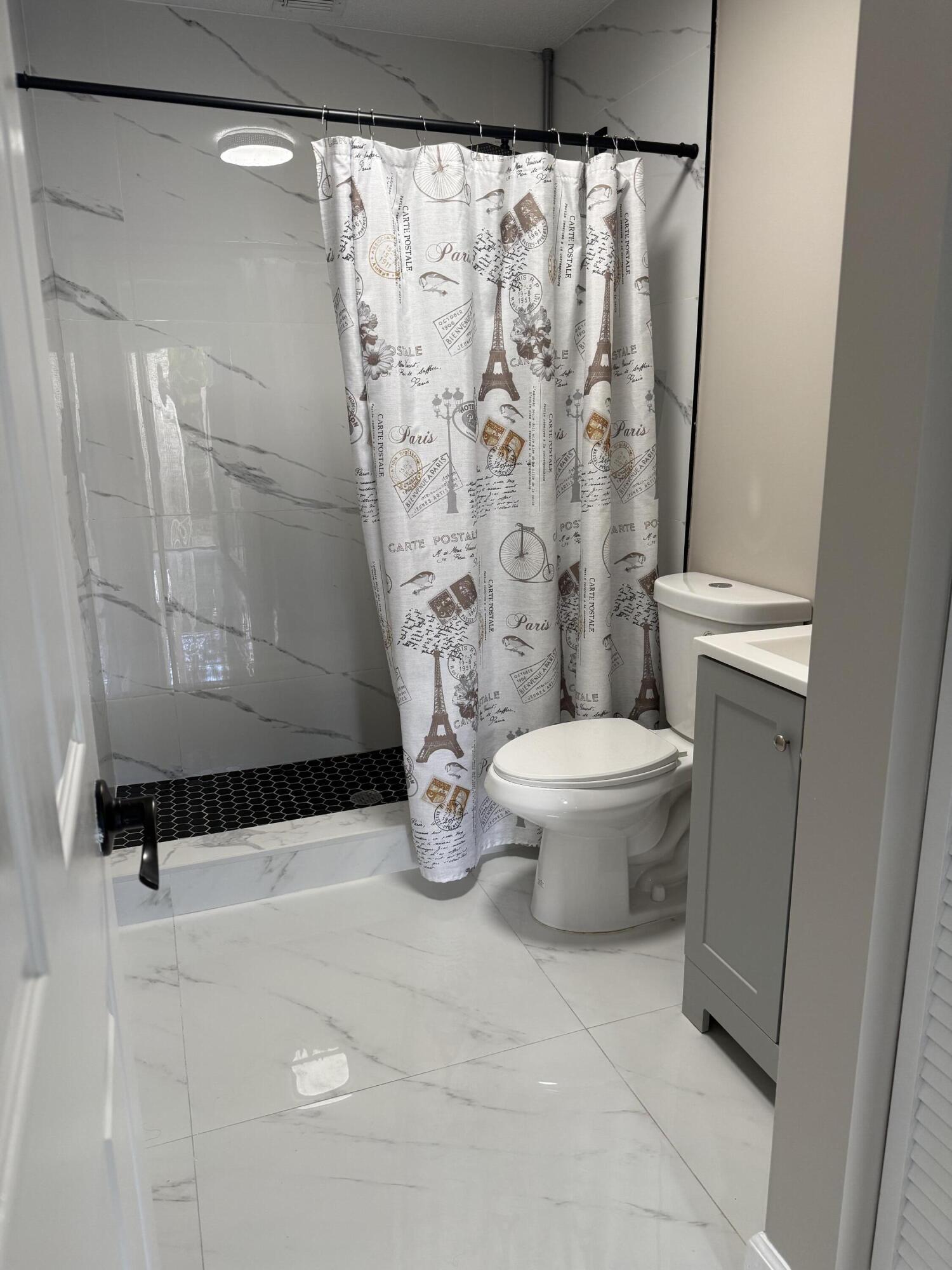 14523 Flamingo Road Loxahatchee Groves, FL 33470 - Photo 50 of 50 a bathroom with a toilet and a shower