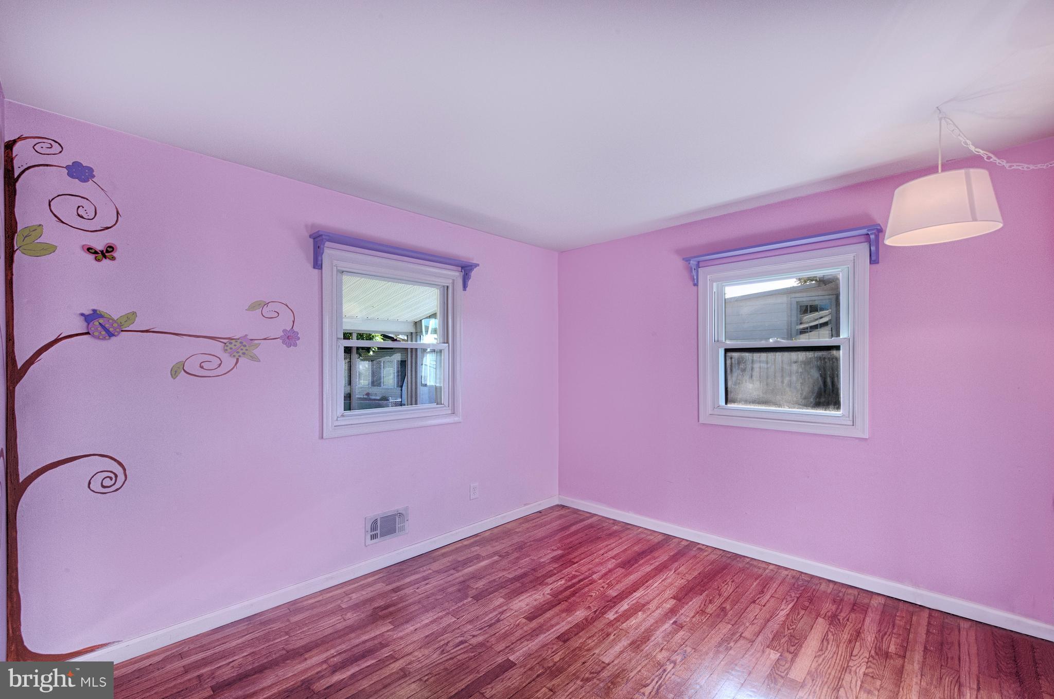 529 Crisfield Road Baltimore, MD 21220 - Photo 11 of 19 a view of empty room with wooden floor and fan