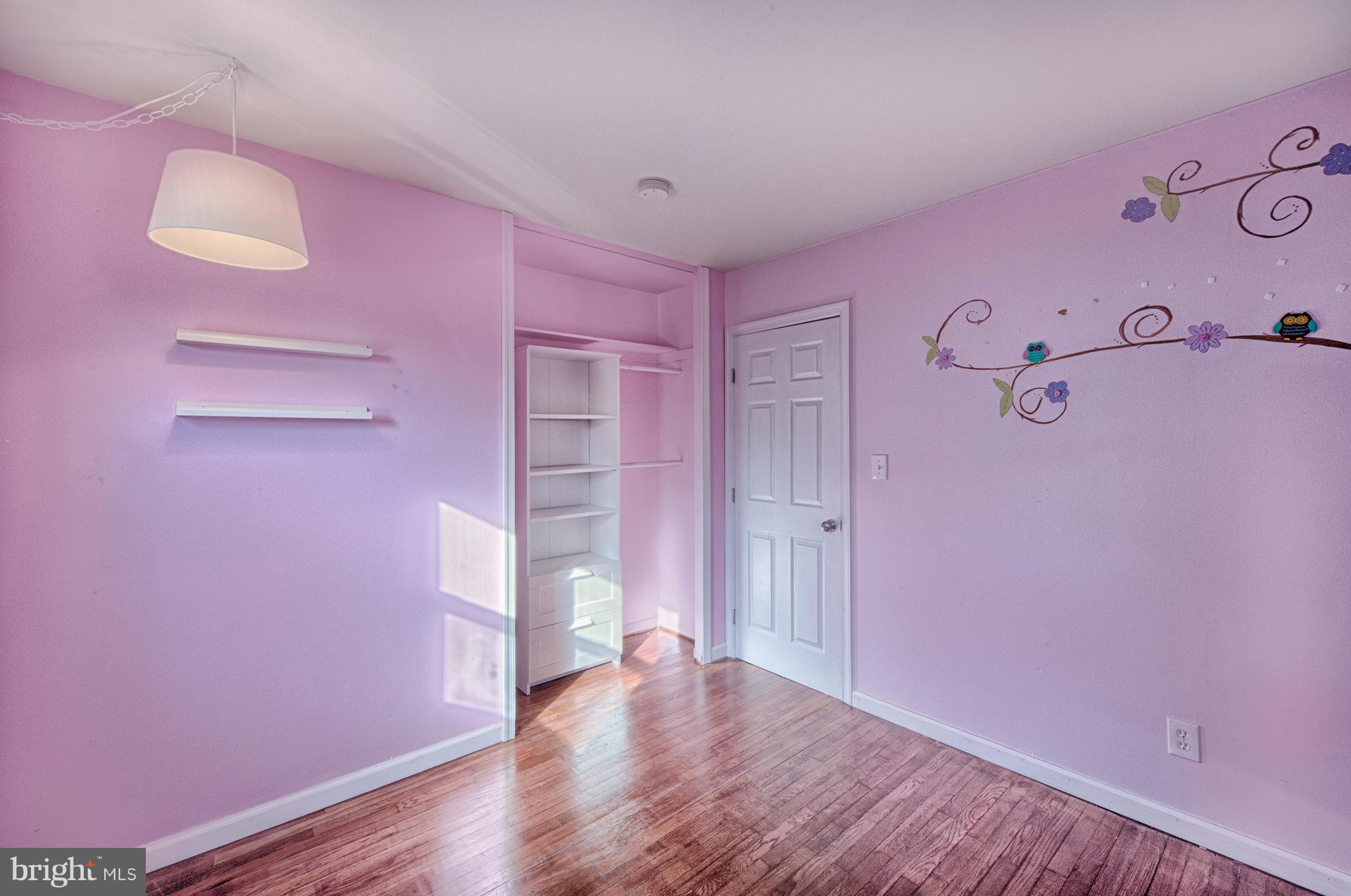 529 Crisfield Road Baltimore, MD 21220 - Photo 12 of 19 wooden floor in a pink room
