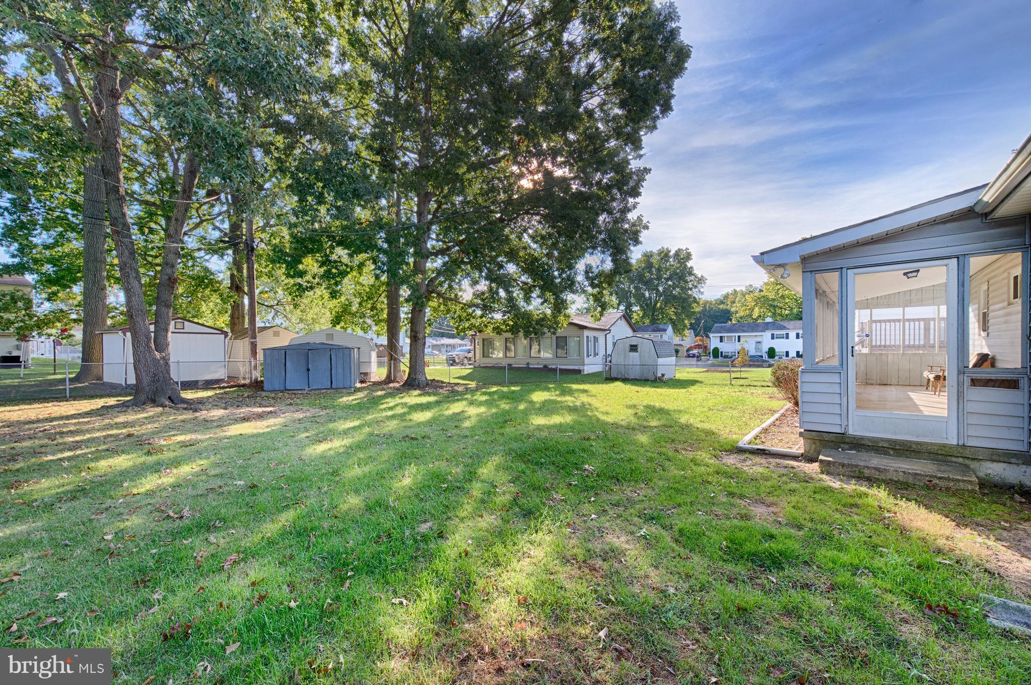 529 Crisfield Road Baltimore, MD 21220 - Photo 17 of 19 a view of a house with backyard and a tree