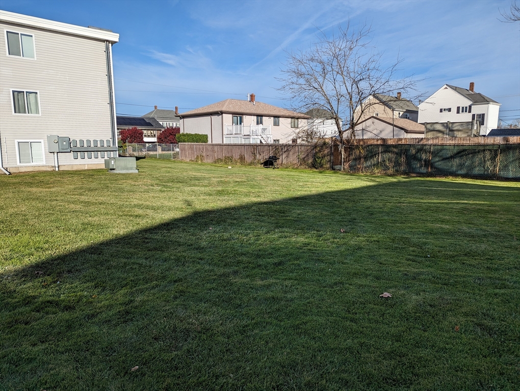 191 Glasgow Street, Unit 3 Fall River, MA 02721 - Photo 16 of 16 a view of a house with a big yard and large trees