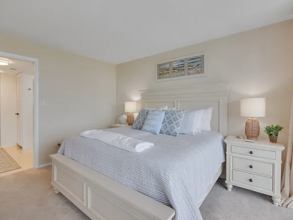 a bedroom with a bed and a closet