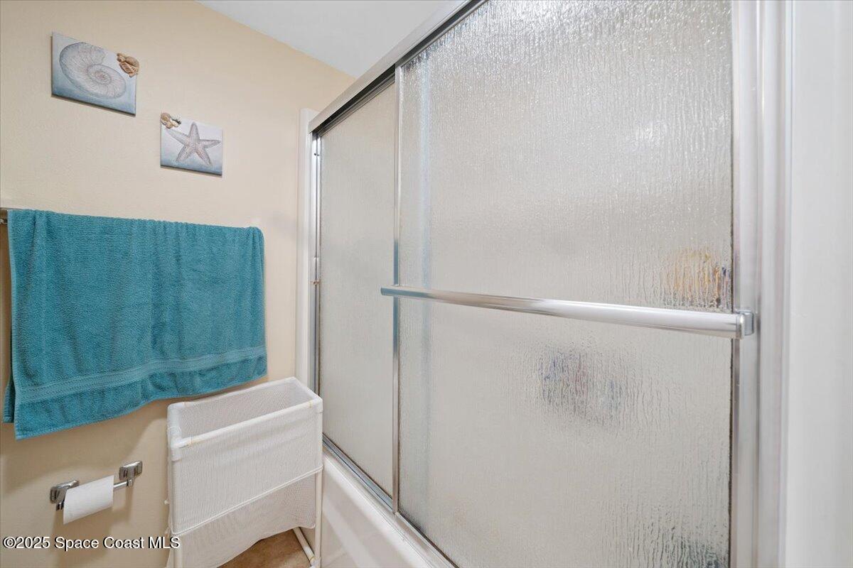 1713 Patty Circle Northeast Palm Bay, FL 32905 - Photo 21 of 26 a bathroom with a shower and a sink