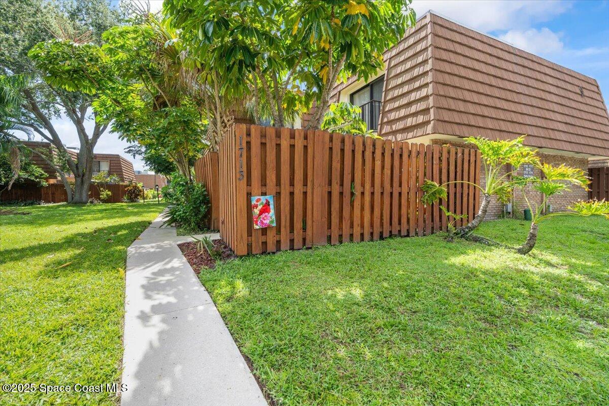 1713 Patty Circle Northeast Palm Bay, FL 32905 - Photo 26 of 26 a view of a pathway with a garden