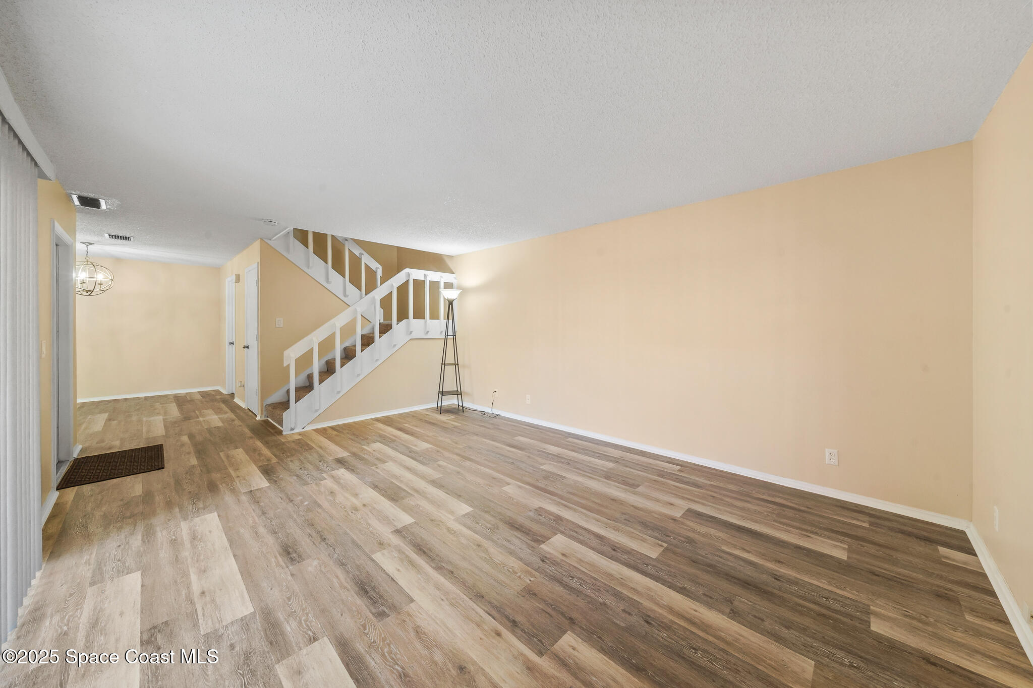 1713 Patty Circle Northeast Palm Bay, FL 32905 - Photo 9 of 26 a view of entryway and hall with wooden floor