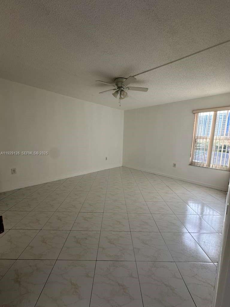 4801 Northwest 7th Street, Unit 21016 Miami, FL 33126 - Photo 12 of 18 a view of an empty room with a window