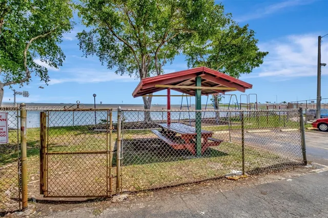 a view of a backyard with sitting area